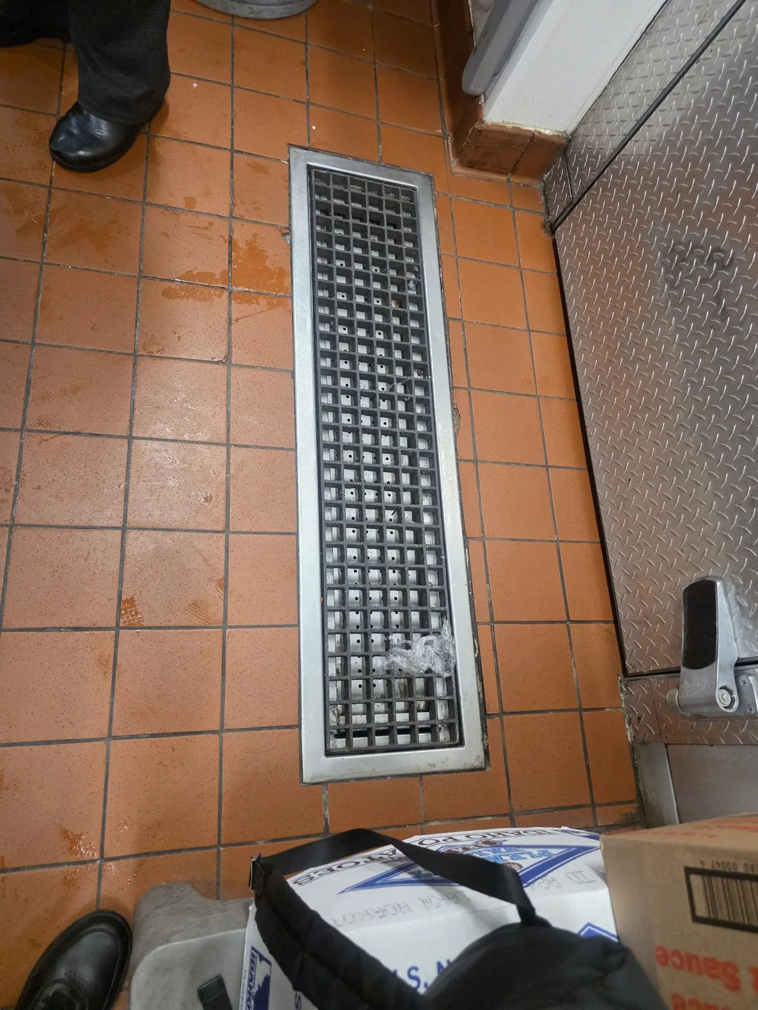 Before photo of Grate and Tile Repair